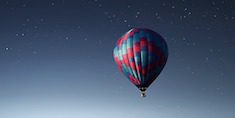 Hot air balloon in the night sky