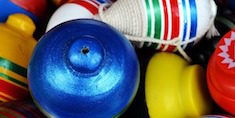 Pile of colorful spinning top toys